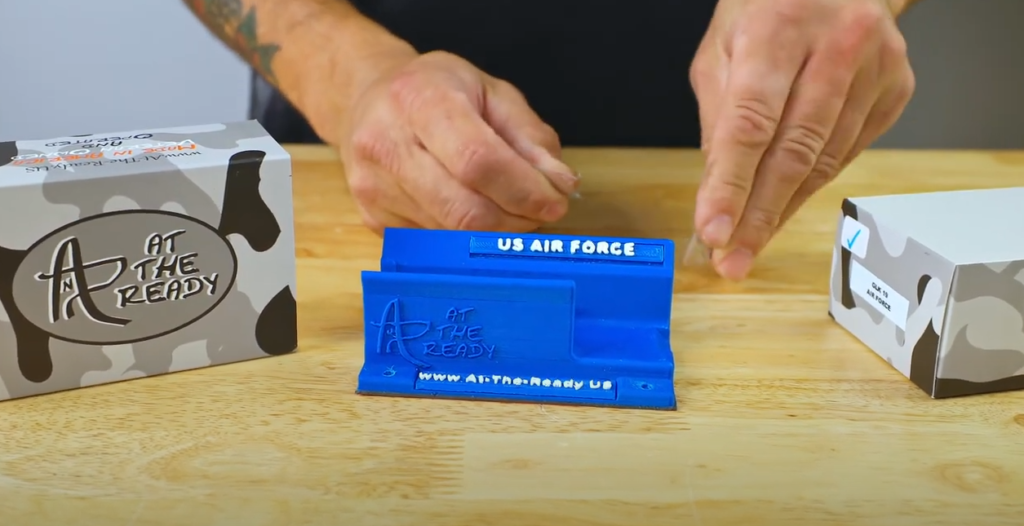 Unboxing a magnetic gun mount with its installation kit before install